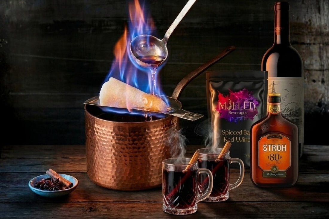 Feuerzangenbowle flaming sugar cone over copper cauldron with Mulled Beverages spiced bags Stroh rum and steaming mulled wine glasses